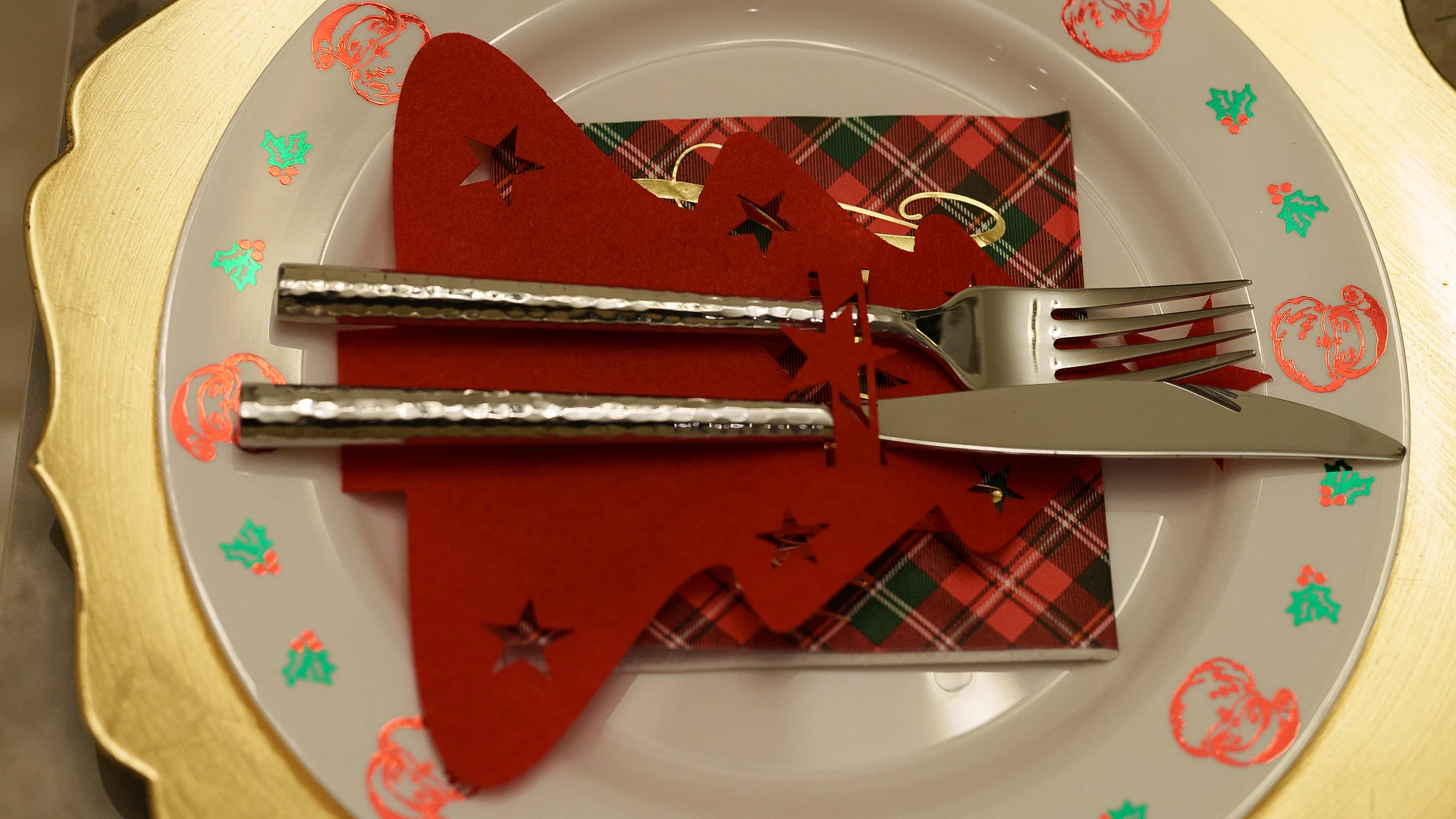 A folded napkin on a Christmas plate