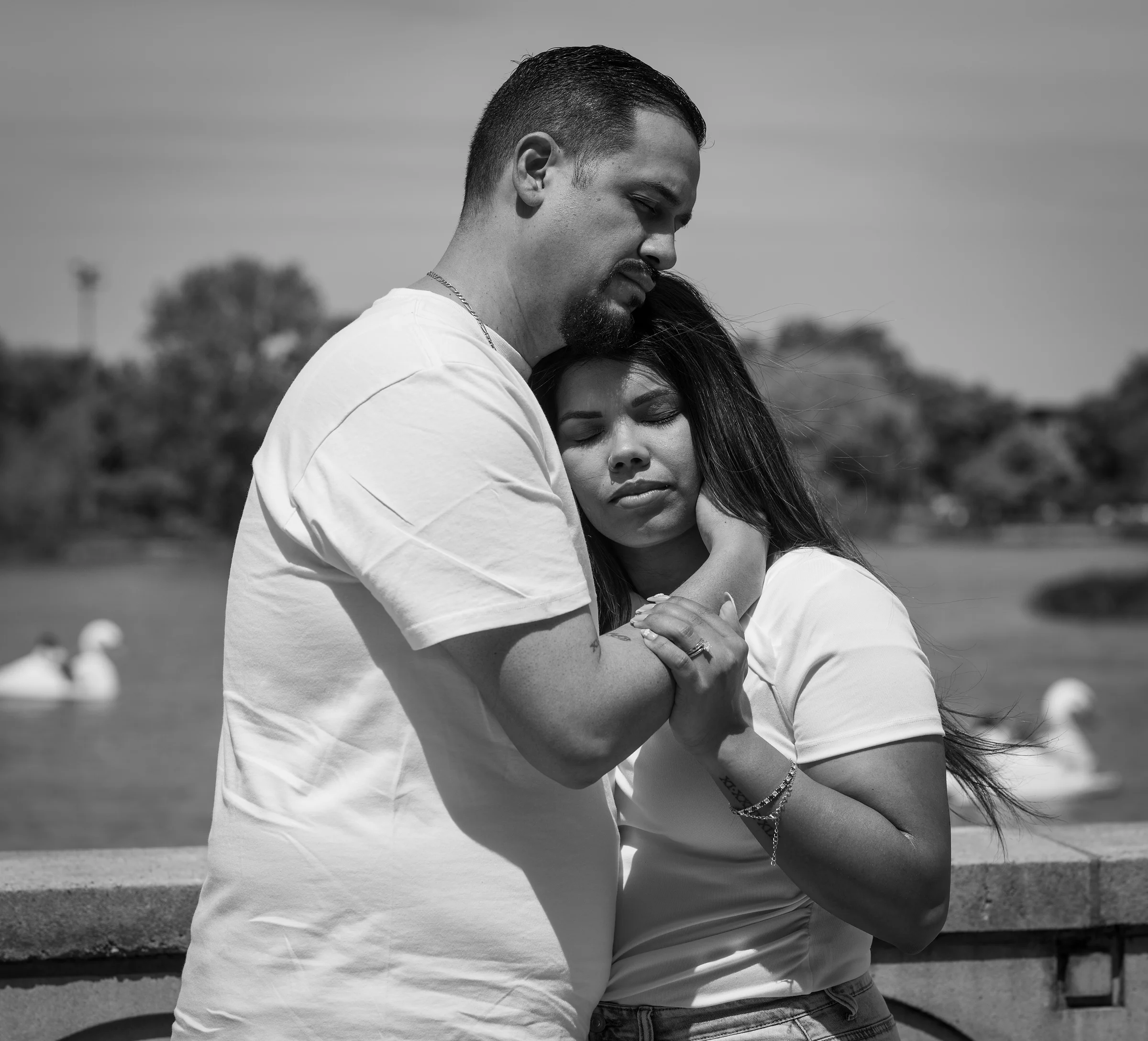 Held close by the water, in black and white
