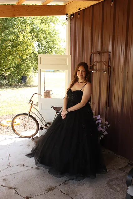 The bride by the barn with the bicycle
