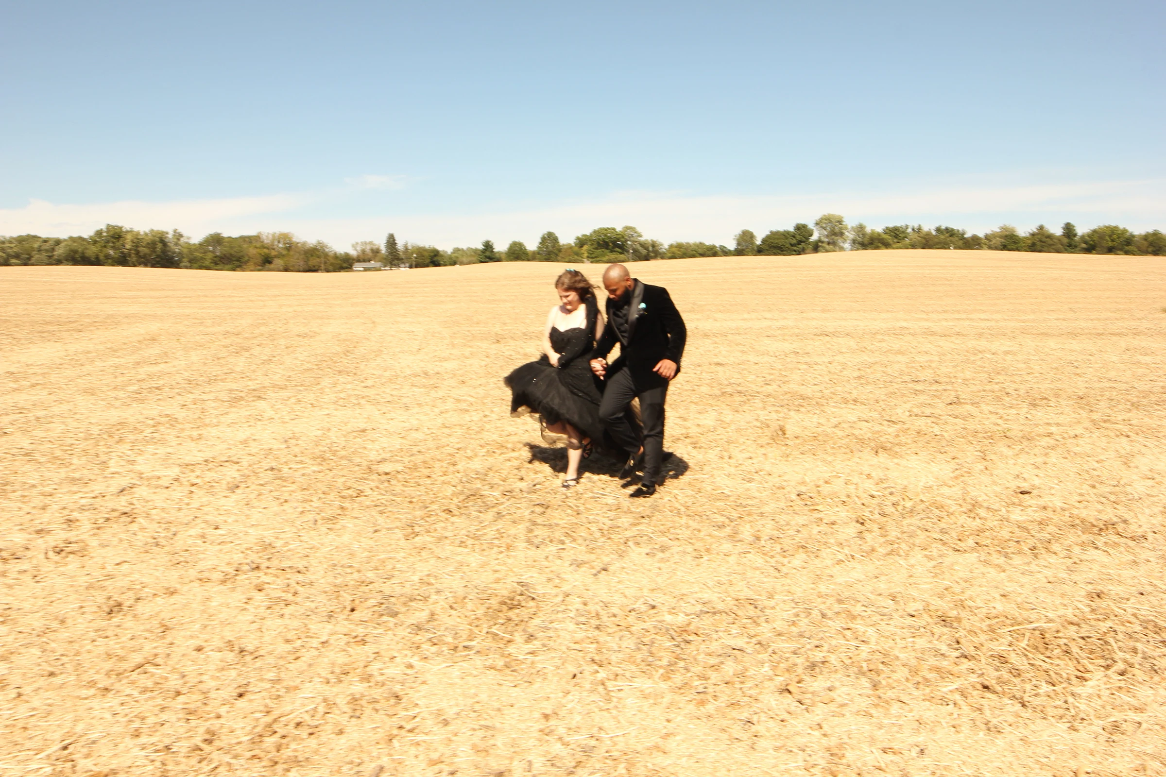 The couple and their daughter in the field