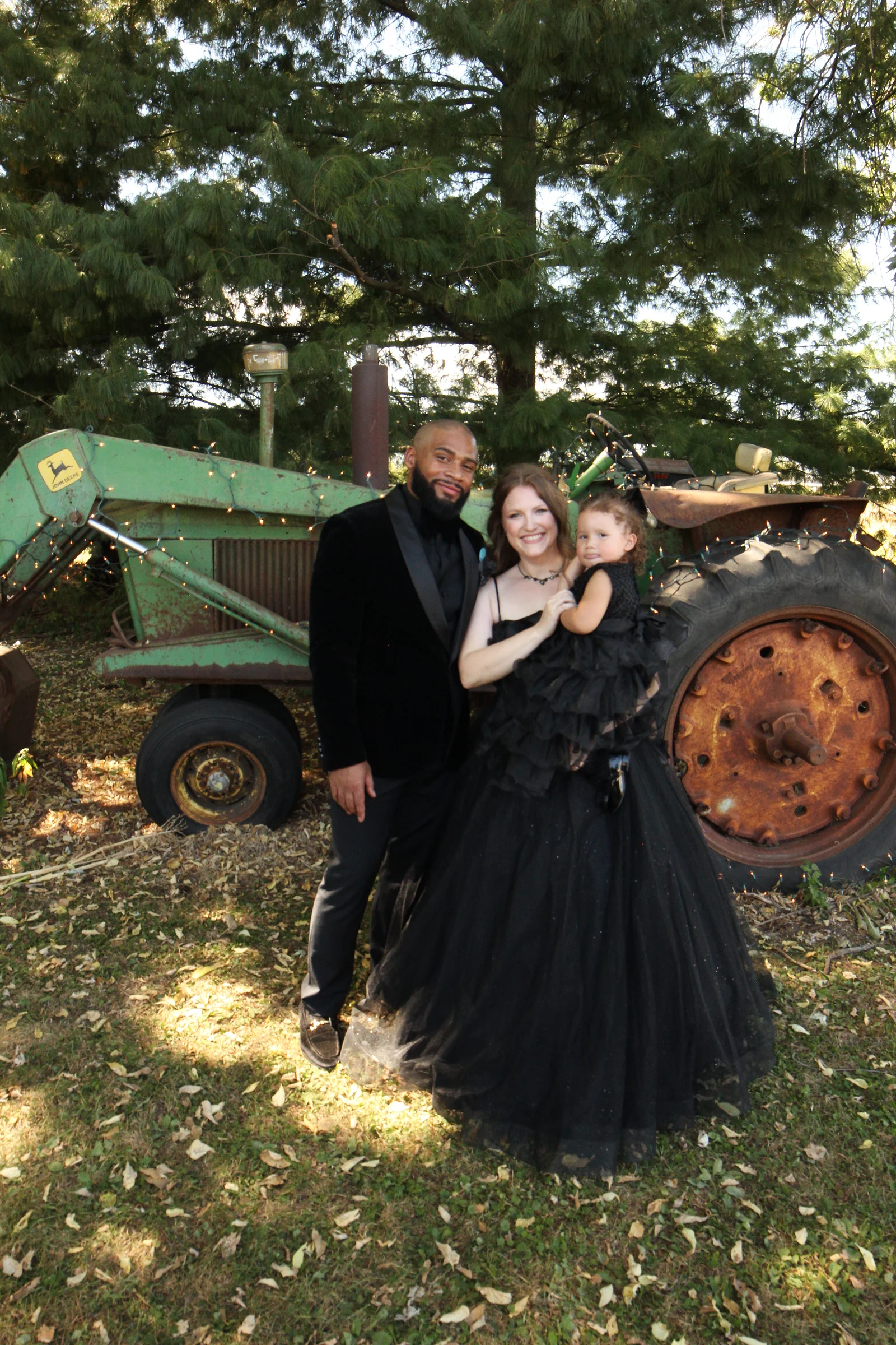 The family by the green tractor