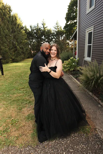 The couple by the house