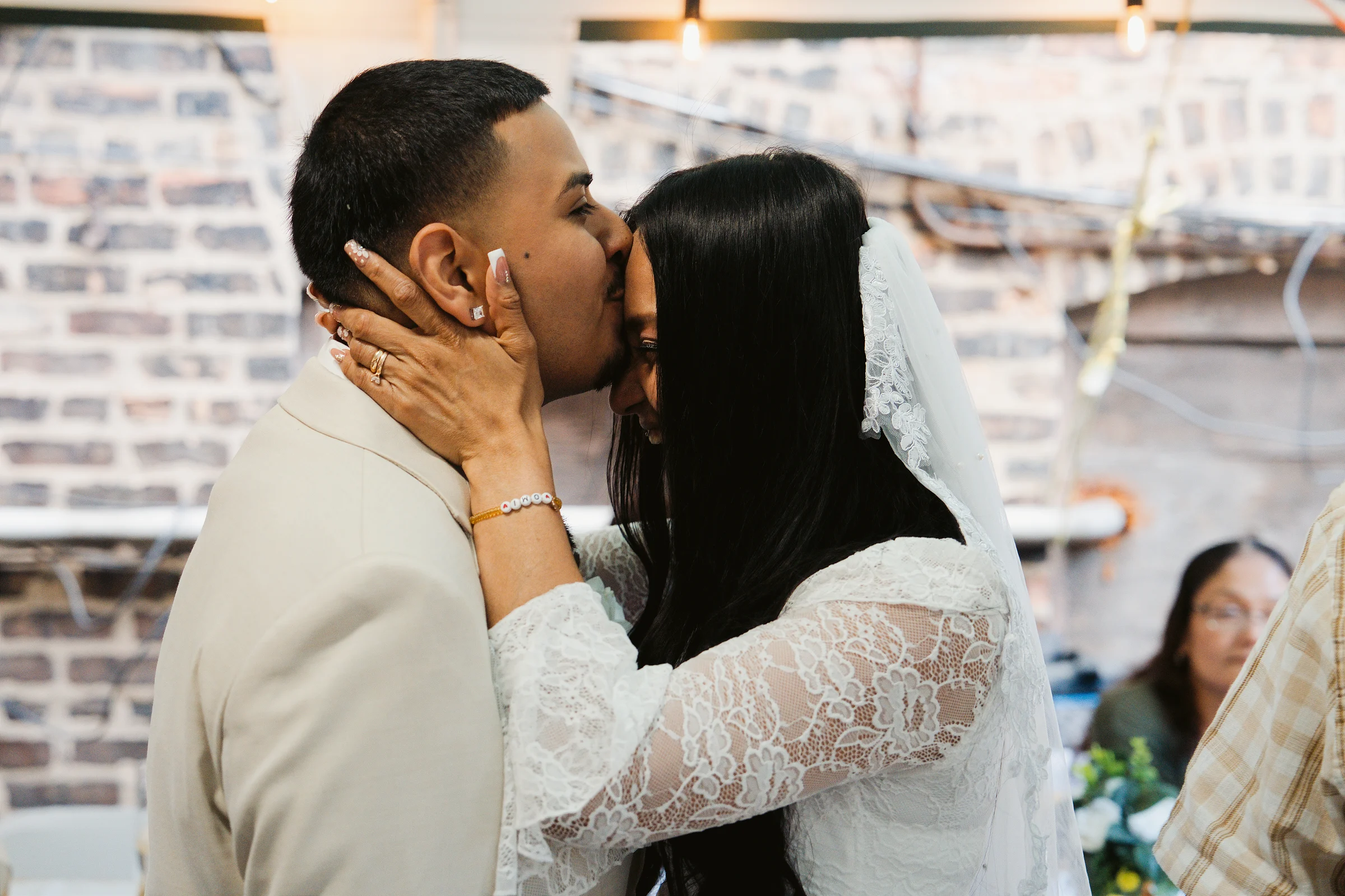 A kiss on the cheek at the reception