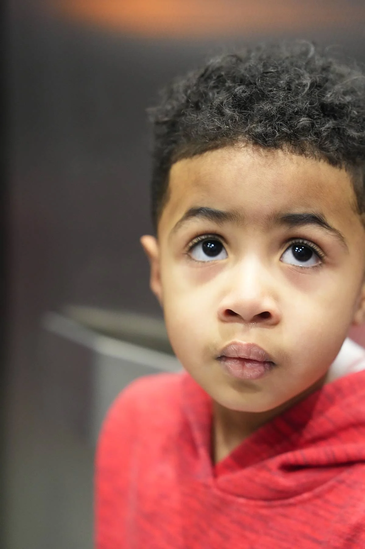 A boy in red, close