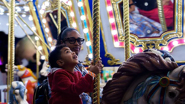 The carousel, both of them riding