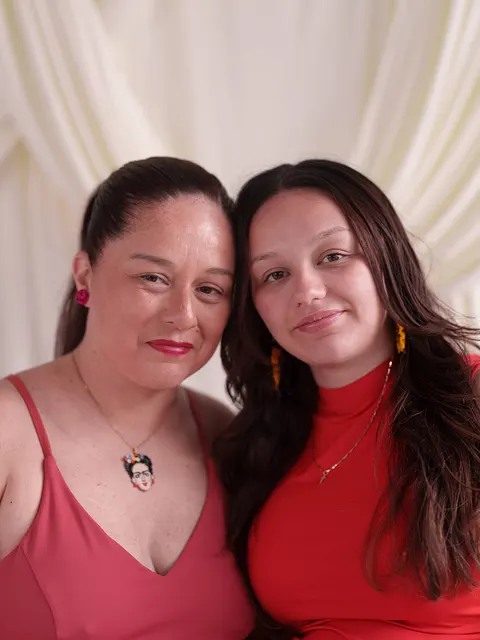 A mother and her daughter in red