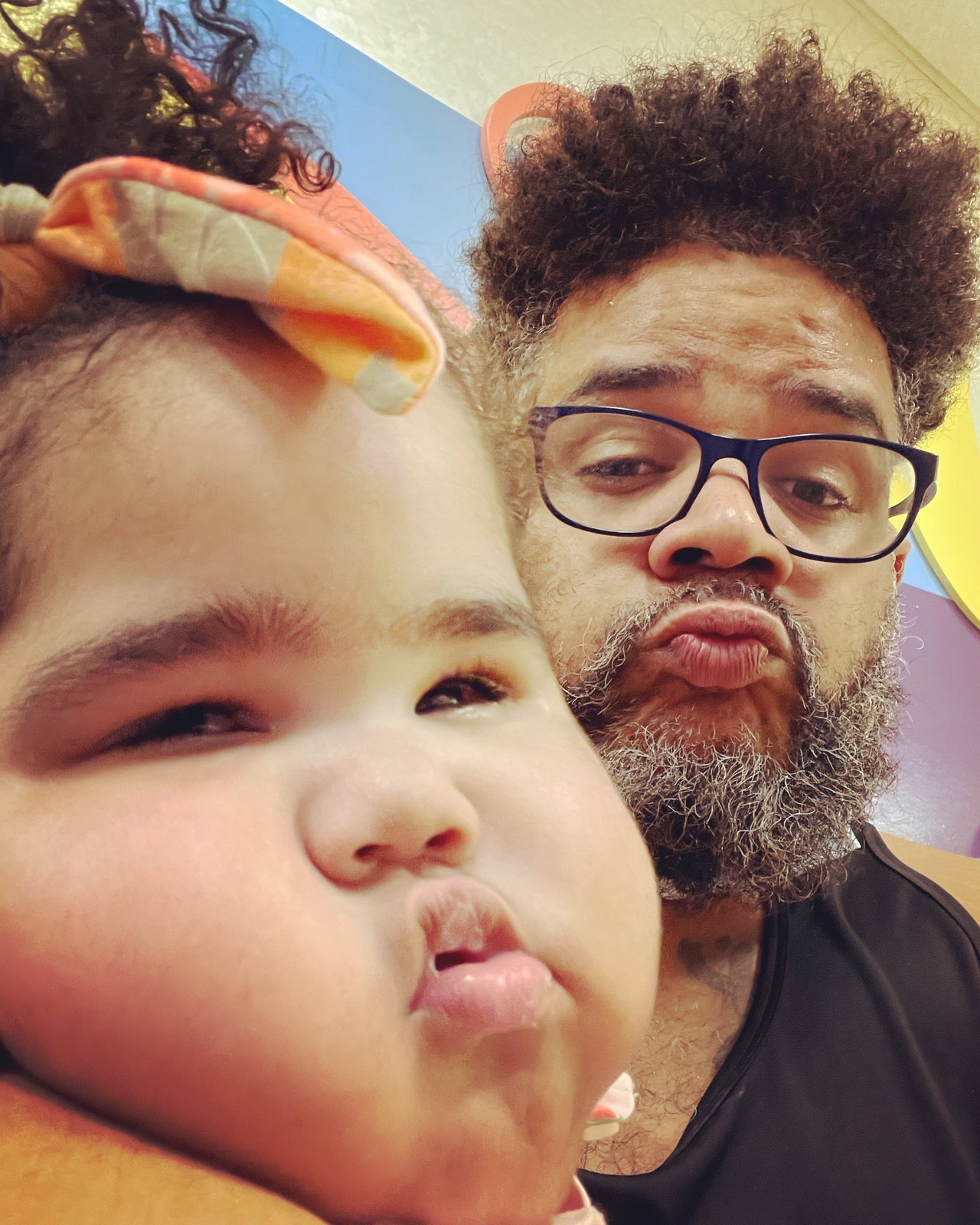 Falú and Havana cheek to cheek, both making a kissing face at the camera.